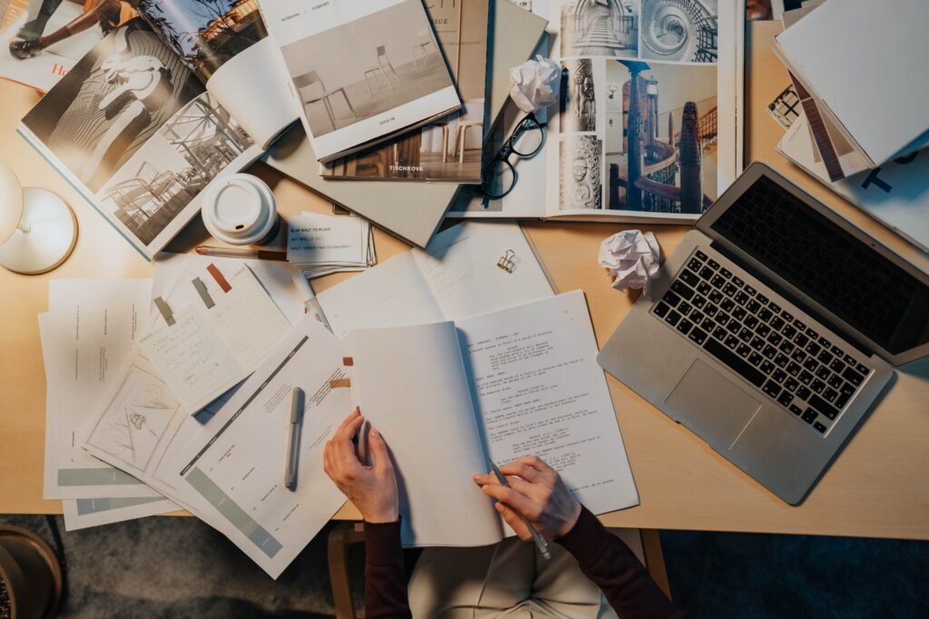 person procrastinating at desk while working