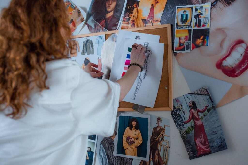 woman creating a fashion inspiration board with outfit ideas